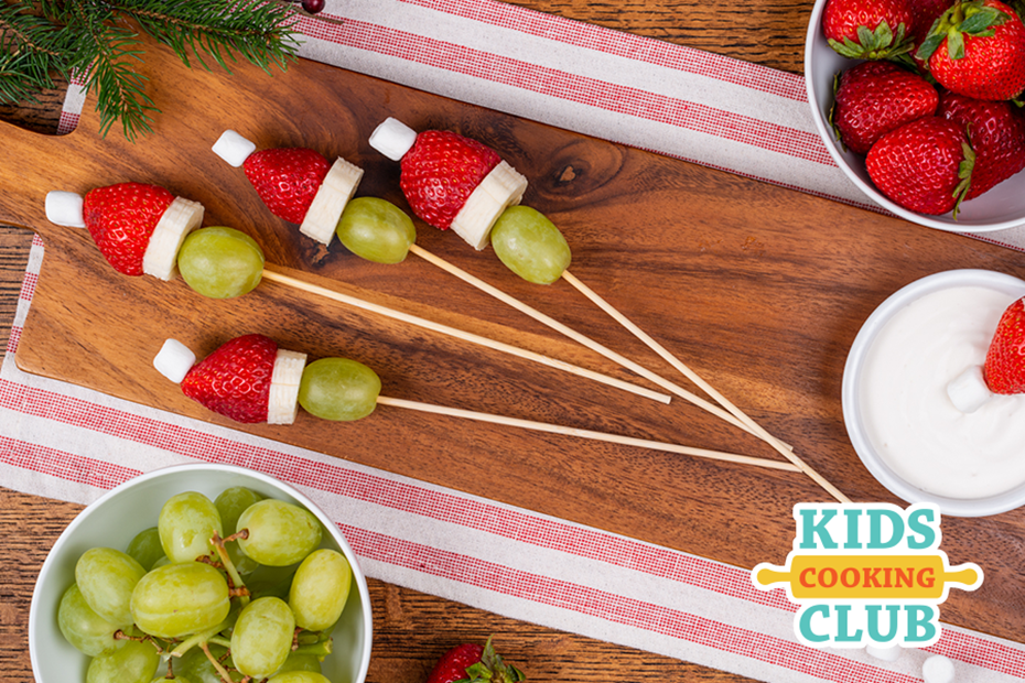 Grinch hats on a skewer made with green grapes, strawberries and mini-marshmallows