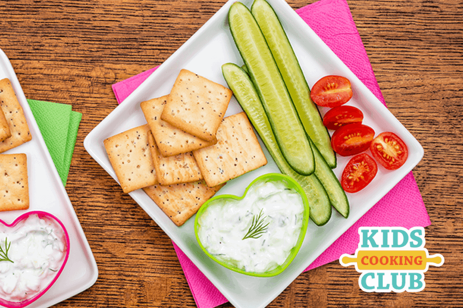 Tzatziki dip served with veggies on a plate