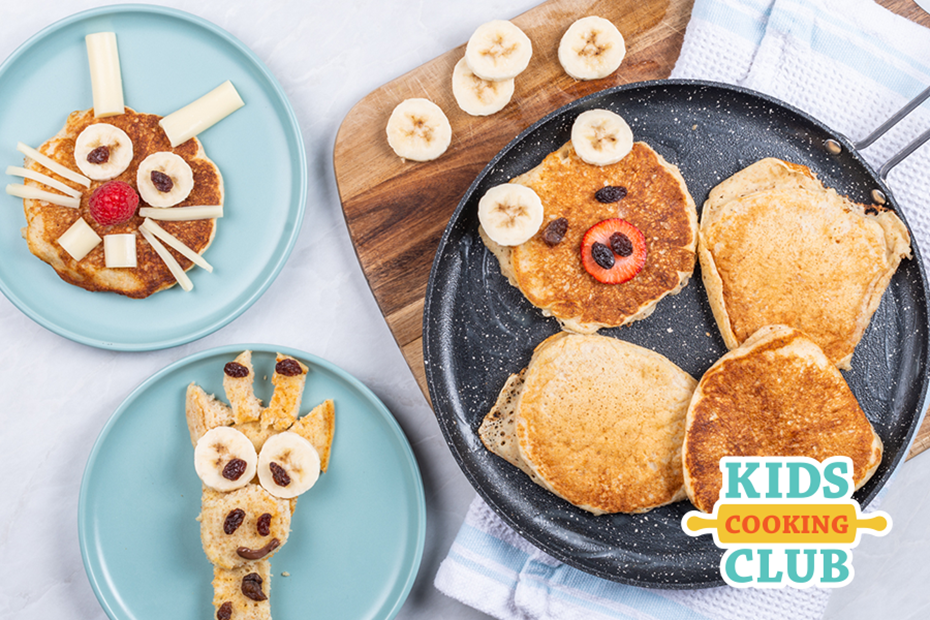animal pancakes made with pancakes and decorated with cheese sting, bananas and a berries. Logo: Kids Cooking Club